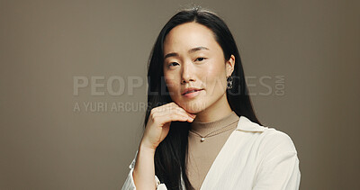 Buy stock photo Beauty, studio and portrait of Asian woman for wellness, skincare and facial treatment. Mockup space, spa and face of person with natural skin for cosmetics, salon and shine on brown background