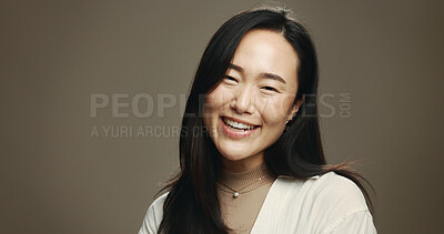 Buy stock photo Skincare, happy and portrait of Asian woman in studio with beauty, natural and facial mockup. Glow, space and female person with face dermatology treatment for hydration by brown background.