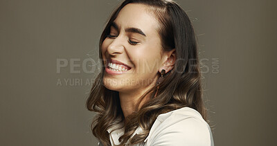 Buy stock photo Laugh, comedy and woman in studio with smile, excited and happiness isolated on background with space. Face, funny and female model with eyes closed for goofy joke, comic humor and lol emotion for 