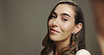 Woman, portrait and selfie in studio with makeup, natural beauty or smile. Influencer, confident or POV on gray background space for photography, social media engagement or cosmetics tutorial results