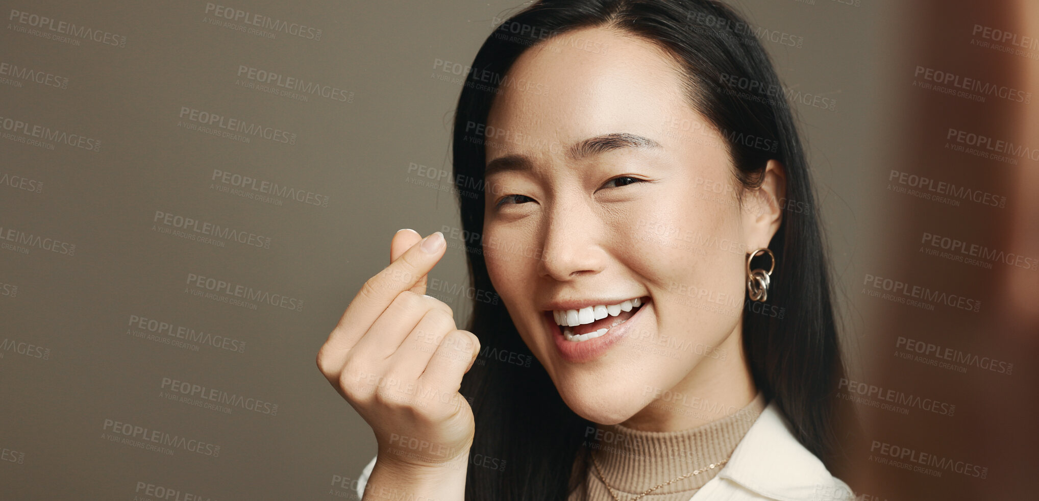 Buy stock photo Woman, selfie and heart fingers in studio, smile and portrait with love, emoji and mockup space by background. Influencer, girl and excited with symbol, gesture or happy on social media in Cambodia