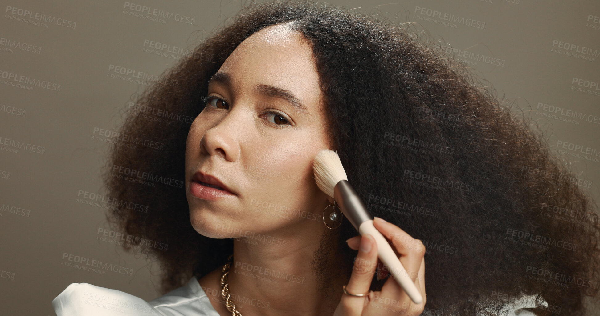 Buy stock photo Woman, makeup brush and foundation in studio for beauty, portrait or application on background. Person, model and tools for color, gear or powder for cosmetic transformation with equipment in Brazil