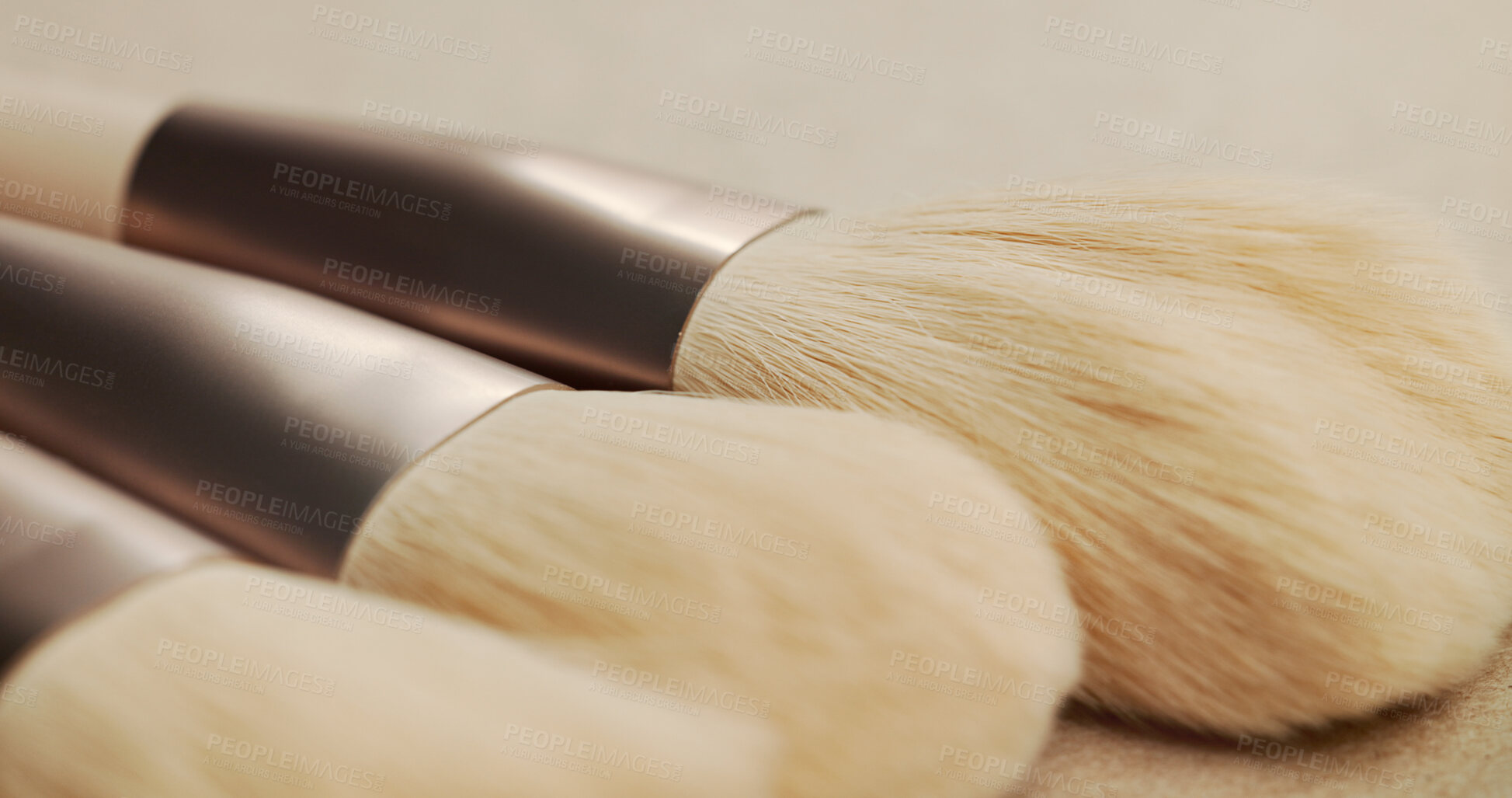 Buy stock photo Closeup, makeup brush and beauty with equipment in studio for transformation, cosmetics and color. Tools, gear and zoom for change, foundation or powder for skin, aesthetic and salon service on table