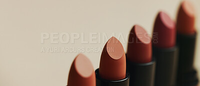 Buy stock photo Product space, makeup or lipstick in studio for elegance, beauty and luxury cosmetics on brown background. Closeup, aesthetic and dermatology for mouth grooming, makeover and choice for selection