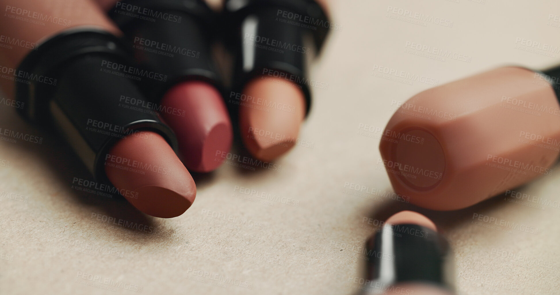 Buy stock photo Closeup, lipstick and cosmetics with equipment in studio for transformation, beauty and color. Tools, gear and makeup for change, foundation or powder for skin, aesthetic and salon service on table
