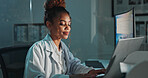 Science, laptop and woman in lab at night for medical research, innovation and vaccine development. Healthcare, pharmaceutical and scientist on computer for medicine, breakthrough and discovery