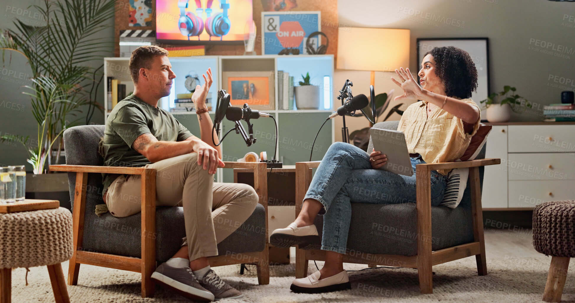Buy stock photo Men, lounge and podcast with mic, conversation and home studio with listen for live streaming on social media. People, presenter and interview with discussion, story or review for culture on web show