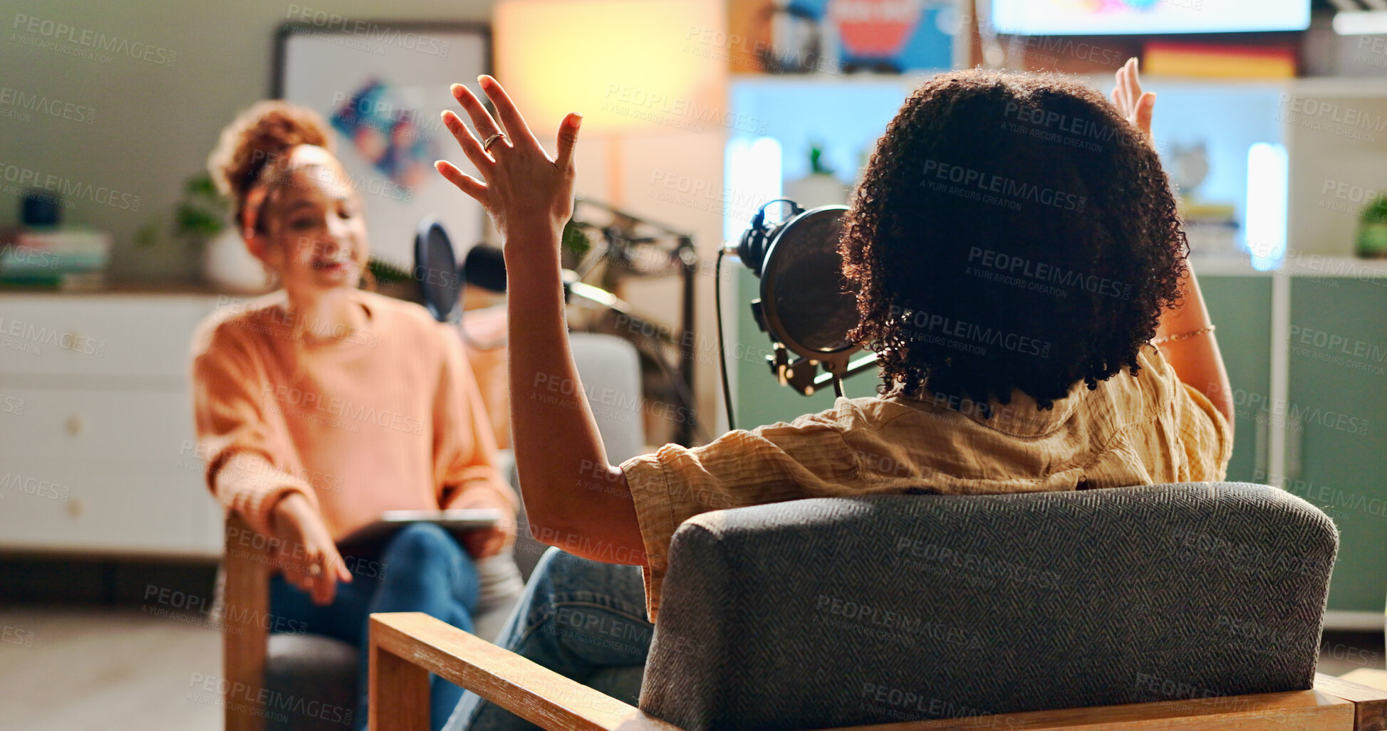 Buy stock photo Women, happy and podcast with mic, conversation and home studio with questions on social network. People, presenter and interview with discussion, chat and live streaming for culture on web show