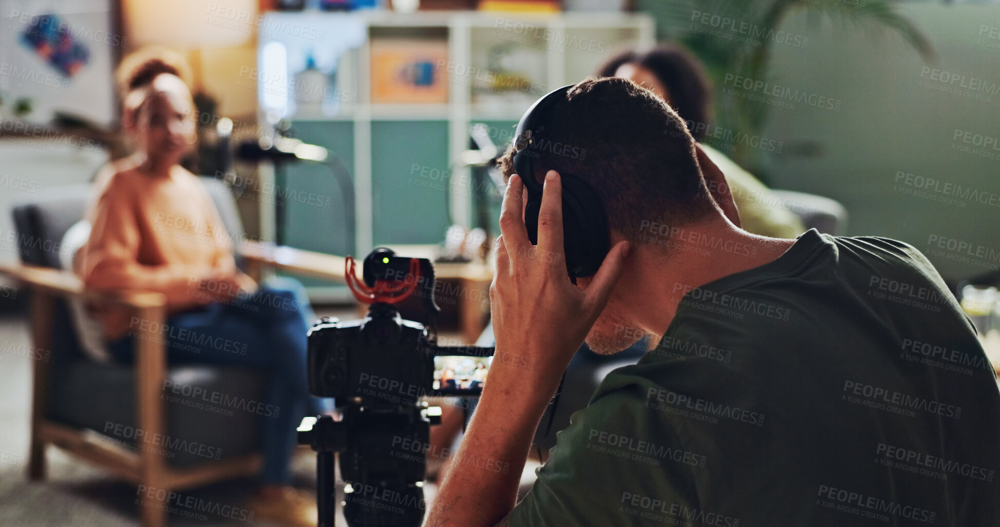 Buy stock photo Headphones, podcast and streaming with director in studio for videography or live broadcast on air. Camera, content creation and recording with sound engineer on set for creative collaboration