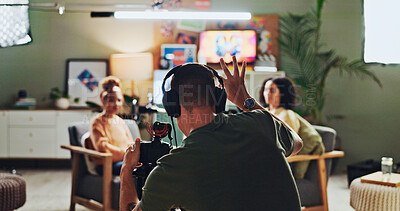 Buy stock photo Interview, podcast and streaming with director in studio for videography or live broadcast on air. Camera, content creation and recording with people on production set for creative collaboration