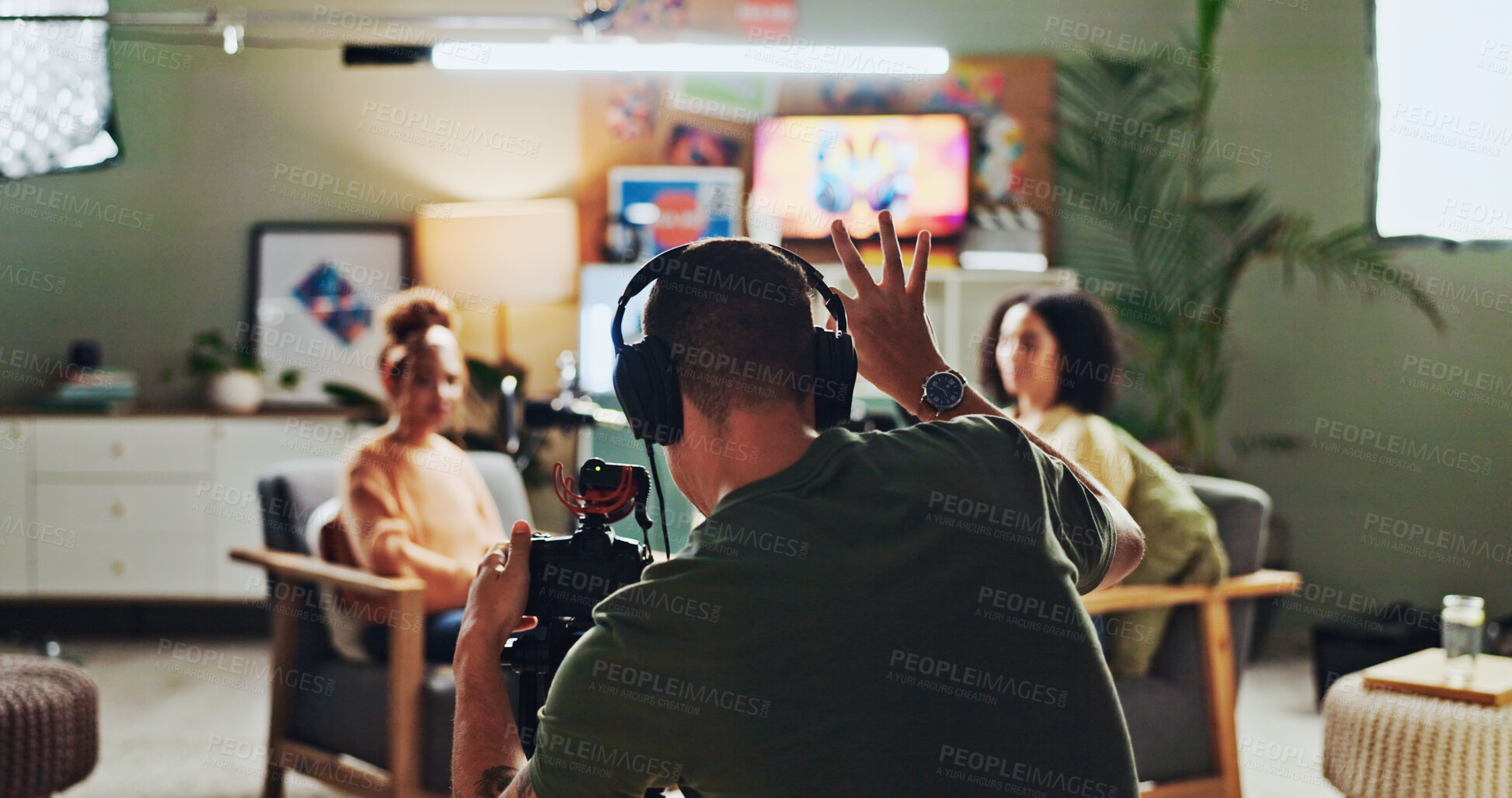 Buy stock photo Interview, podcast and streaming with director in studio for videography or live broadcast on air. Camera, content creation and recording with people on production set for creative collaboration