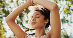 Woman, yoga and eyes closed in park for meditation, breathing and balance with chakra in summer. Girl, self care and outdoor in nature, mindfulness and peace with low angle by trees in Colombia