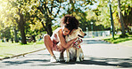 Woman, happy and dog in park, hug and break for fitness with care, love or outdoor in summer with loyalty. Person, animal or pet labrador on path for rest, bonding and training for wellness in Brazil