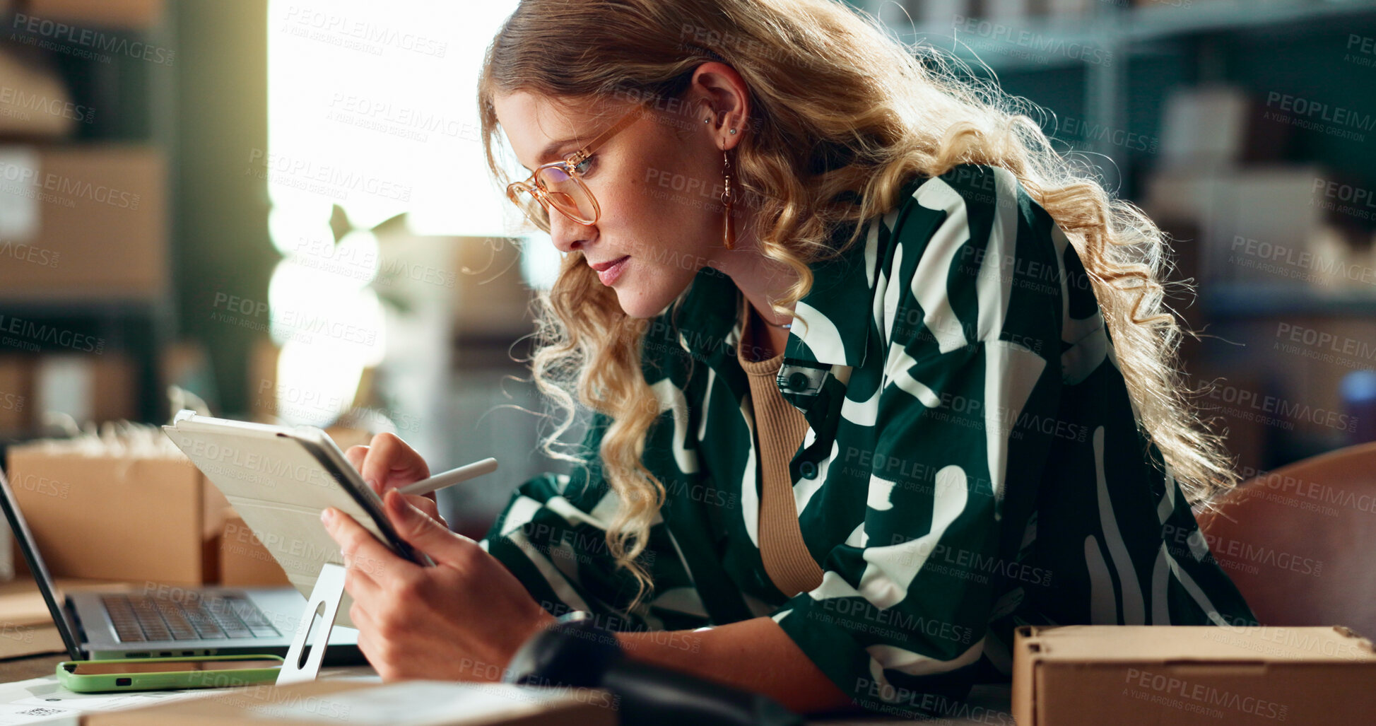 Buy stock photo Logistics, small business and woman writing on tablet for package shipment, online order and courier service. Stylus, dropshipping and person with checklist for ecommerce, distribution and planning