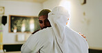 Muslim, faith and people in mosque, hug and worship for Islamic religion, Ramadan and holy spirit. Fajr, praise and men with respect for Allah, embrace and gratitude to God in temple or belief