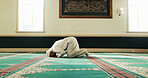 Muslim man, bow and prayer for religion, worship Allah or holy faith in mosque on Eid. Islam, temple and person with peace, hope or praise for spiritual gratitude on floor for dua on ramadan kareem