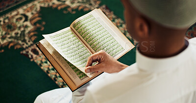 Buy stock photo Islamic, man and Quran in temple for reading, studying and mindfulness with worship to praise Allah. Muslim, male person and above with holy book for guidance, learning scripture and prayer in mosque
