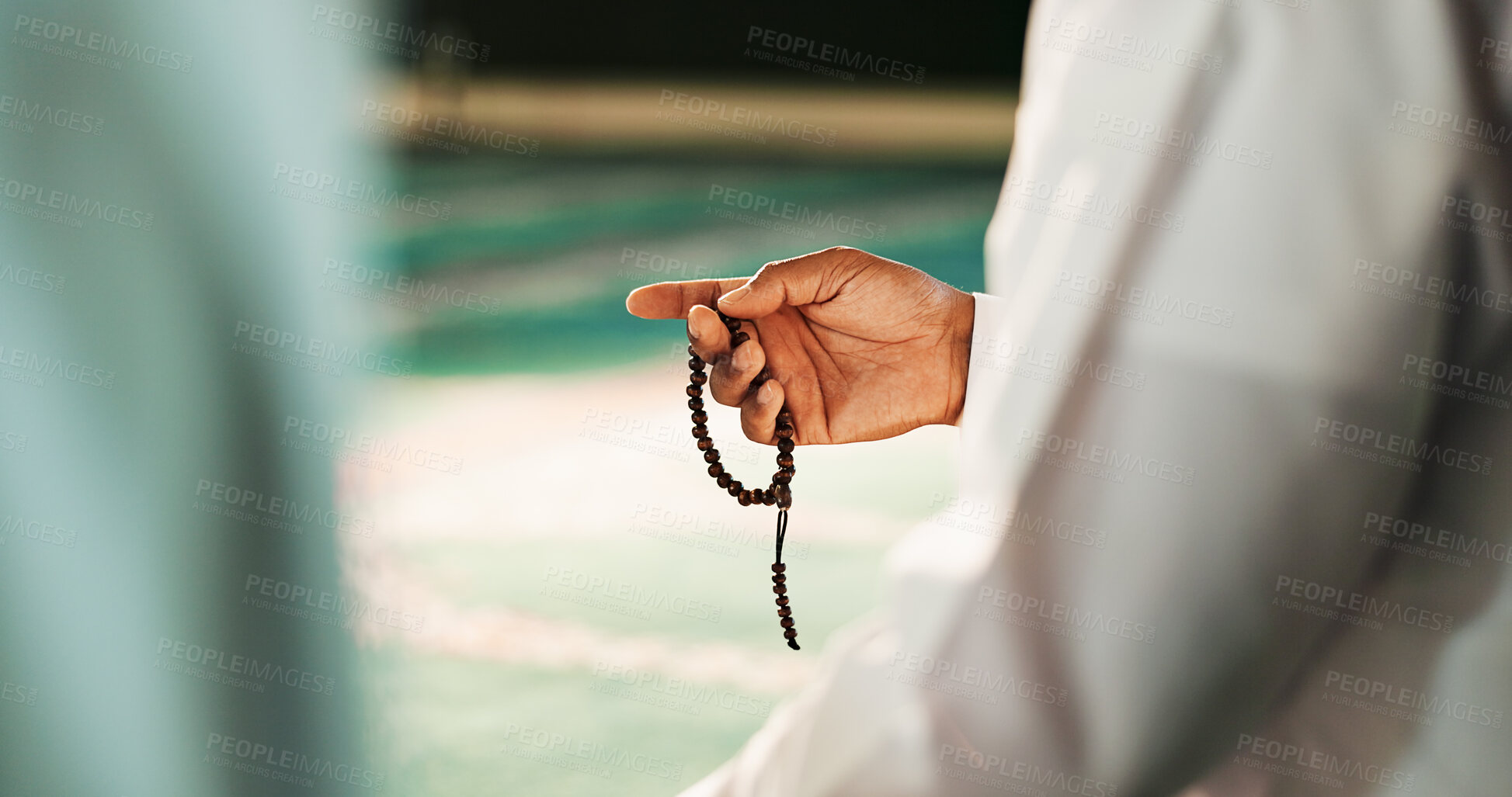 Buy stock photo Muslim, hands and person with prayer beads in mosque, worship and remember of Allah with Quran recitation. Closeup, islamic man and praise with tasbih for faith, gratitude and spiritual in religion