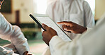 Muslim people, hands and reading on tablet with Quran, holy scripture and teaching faith on screen closeup. Islamic religion, technology or learning in mosque for culture, tradition or students study