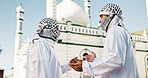 Religion, mosque and muslim men with discussion, outdoor and explaining prayer to friend and worship. Holy temple, spiritual and people with keffiyeh for Islamic faith, conversation and building