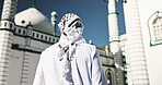 Outdoor, man and mosque for faith, back and architecture for Muslim belief, Islamic and holy building. Structure, scenery and temple to worship Allah, spiritual and landmark for culture or person