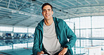 Coach, swimming pool or portrait of happy man with confidence for exercise program. Gym teacher, indoor facility and proud male personal trainer in fitness center for wellness or training performance