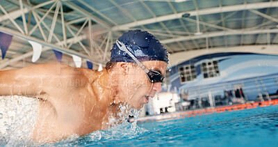 Buy stock photo Swimming, energy and athlete in pool, water and practice for competition, healthy and workout in morning. Active, swimmer and person with routine for performance, exercise and training for sports