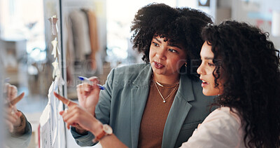 Buy stock photo Pointing, brainstorming and women with sticky notes, business and fashion designer with ideas for brand. Talk, entrepreneur and people with info for clothing design, collaboration and plan for launch