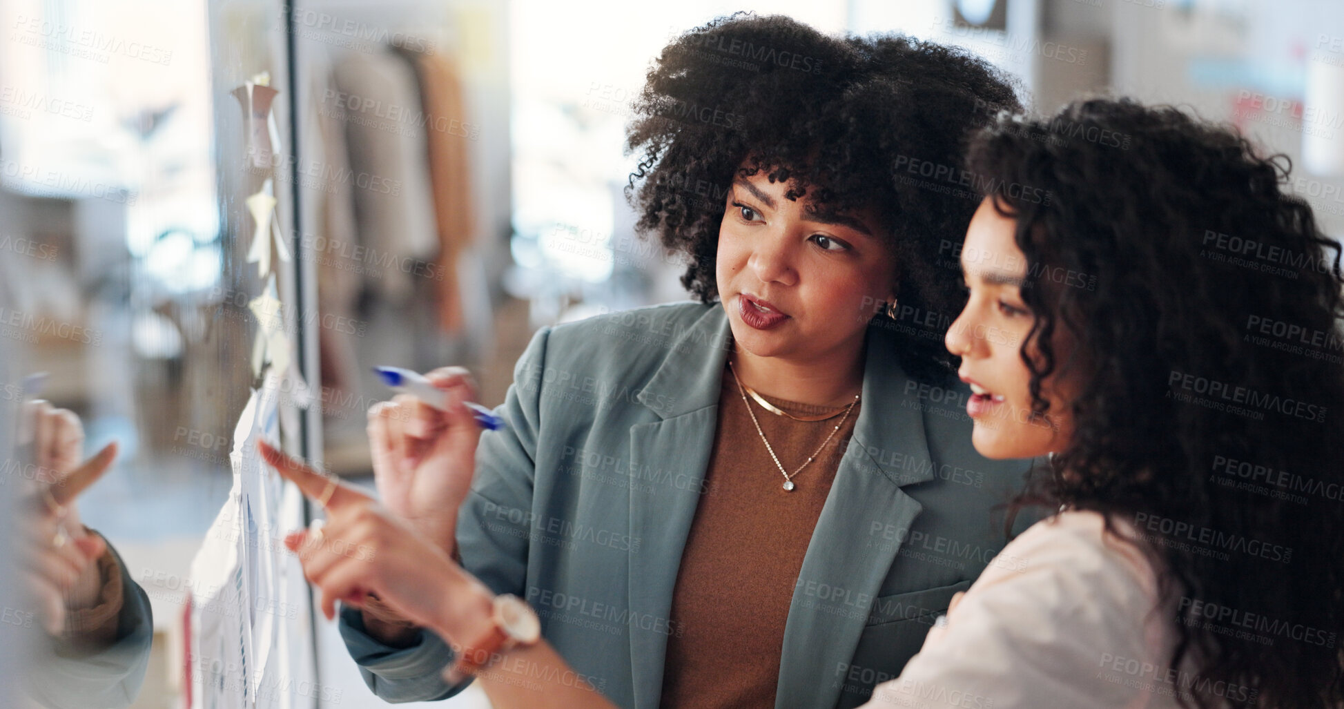 Buy stock photo Pointing, brainstorming and women with sticky notes, business and fashion designer with ideas for brand. Talk, entrepreneur and people with info for clothing design, collaboration and plan for launch