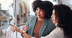 Writing, planning and women with sticky notes, business and fashion designer with ideas for brand. Entrepreneur, teamwork and people with info for clothing design, stylist or brainstorming for launch