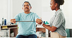Resistance band, physical therapy and senior man in clinic for consultation with muscle recovery. Injury, healthcare and woman physiotherapist helping mature male patient with stretch arm exercise