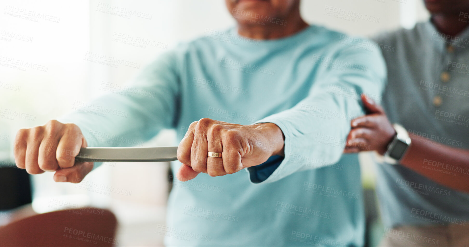 Buy stock photo Resistance band, physical therapy and hands of man in clinic for consultation with muscle recovery. Injury, healthcare and woman physiotherapist for helping mature patient with stretch arm exercise