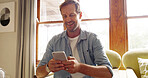 Home, typing and man with smartphone, smile and connection with message to contact. Apartment, mobile user and person in lounge, cellphone and digital app for social media, communication and chatting