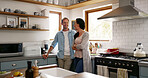 Happy, couple and relax by talking in kitchen for communication, morning chat and bonding together. Smile, people and laughing for funny joke with support, discussion and marriage commitment at house