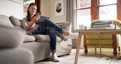 Buy stock photo Home, digital purchase and woman with card, tablet and browsing for online shopping, lounge and web. House, customer and person with discount for transaction, relax or scrolling on app in living room