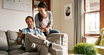 Online shopping, laughing and couple with card, tablet and smile for digital products, lounge and relax. Scrolling, happy and people with tech for transaction, customer or discount on website in home
