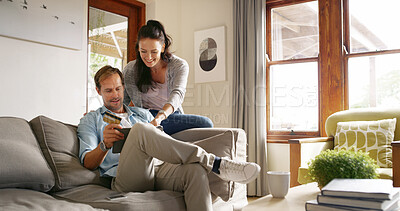 Buy stock photo Happy, online shopping and couple with card, tablet and browsing for digital products, relax and lounge. Living room, smile and people with tech for transaction, customer or scroll on website in home