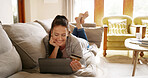 Online shopping, credit card and woman on tablet in home for payment or internet banking. Debit, relax and happy person on sofa for purchase decision, choice and thinking of financial transaction
