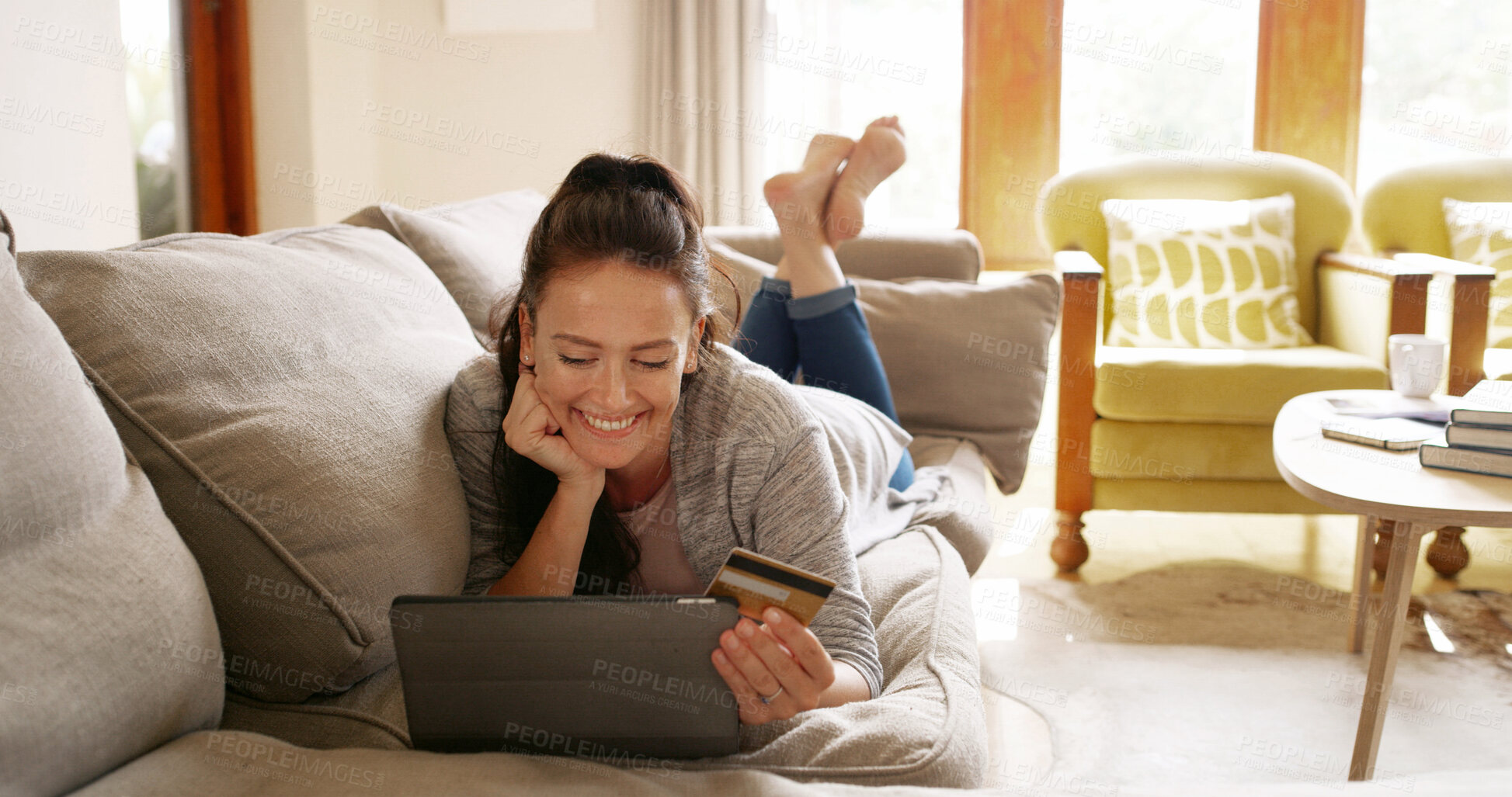 Buy stock photo Online shopping, credit card and woman on tablet in home for payment or internet banking. Debit, relax and happy person on sofa for purchase decision, choice and thinking of financial transaction