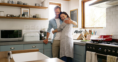 Buy stock photo Hug, couple and bonding in kitchen, relationship and romance for people in house, smile and commitment. Break, woman and embrace with man in apartment, happiness and affection for lover in home
