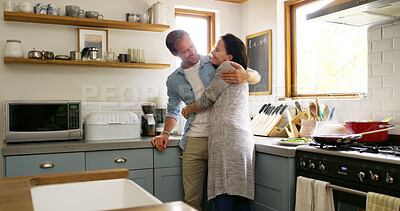Buy stock photo Hug, couple and bonding in kitchen, smile and romance for people in house, relationship and commitment. Break, woman and embrace with man in apartment, happiness and affection for lover in home