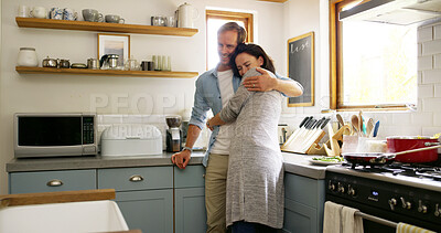 Buy stock photo Hug, couple and bonding in kitchen, affection and romance for people in house, relationship and commitment. Break, woman and embrace with man in apartment, happiness and smile for lover in home