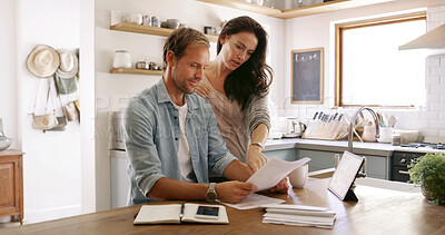 Buy stock photo Home, conversation and couple with documents, finance and payment for mortgage, rent and love. Tax return, budget and man with woman in kitchen, invest or paperwork with report for savings or talking