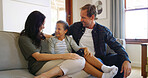 Home, family and parents on sofa, girl and relax with conversation, calm and love in lounge. Apartment, mother and father on couch, daughter and weekend break with support, smile and bonding together