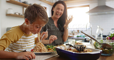 Buy stock photo Laugh, food and pasta with family at kitchen table for nutrition, bonding and healthy growth. Lunch, support and big appetite with mom and child eating at home for love, wellness and funny together