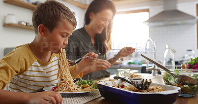 Buy stock photo Eating, food and pasta with family at kitchen table for nutrition, bonding and healthy growth. Lunch, support and happiness with mother and child at home for love, wellness and meal together