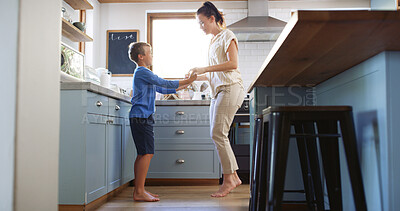 Buy stock photo Home, mother and kid dancing in kitchen with holding hands, teaching steps or weekend break. Happy family, woman and boy with music for movement, learning and relationship with love, bonding or trust