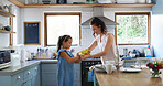 Mother, helping and child with gloves in kitchen for spring cleaning, hygiene or chores together. Care, bonding and mom teaching girl kid safety for bacteria, dust or dirt for washing dishes in home.