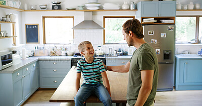 Buy stock photo Home, father and boy in kitchen, smile and funny with humor, support and bonding together. Parent, family and apartment with dad, son and happiness with break, conversation and laughing for joke