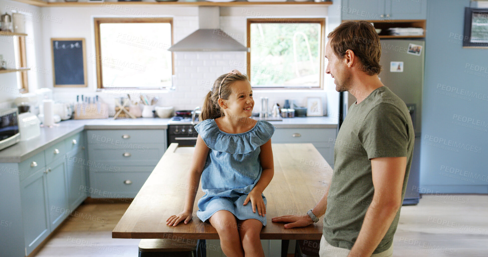 Buy stock photo Child, relax and father talking in kitchen for funny joke, playful lesson and bonding together. Smile, man and kid on counter for discussion, love and morning chat with dad for advice at house